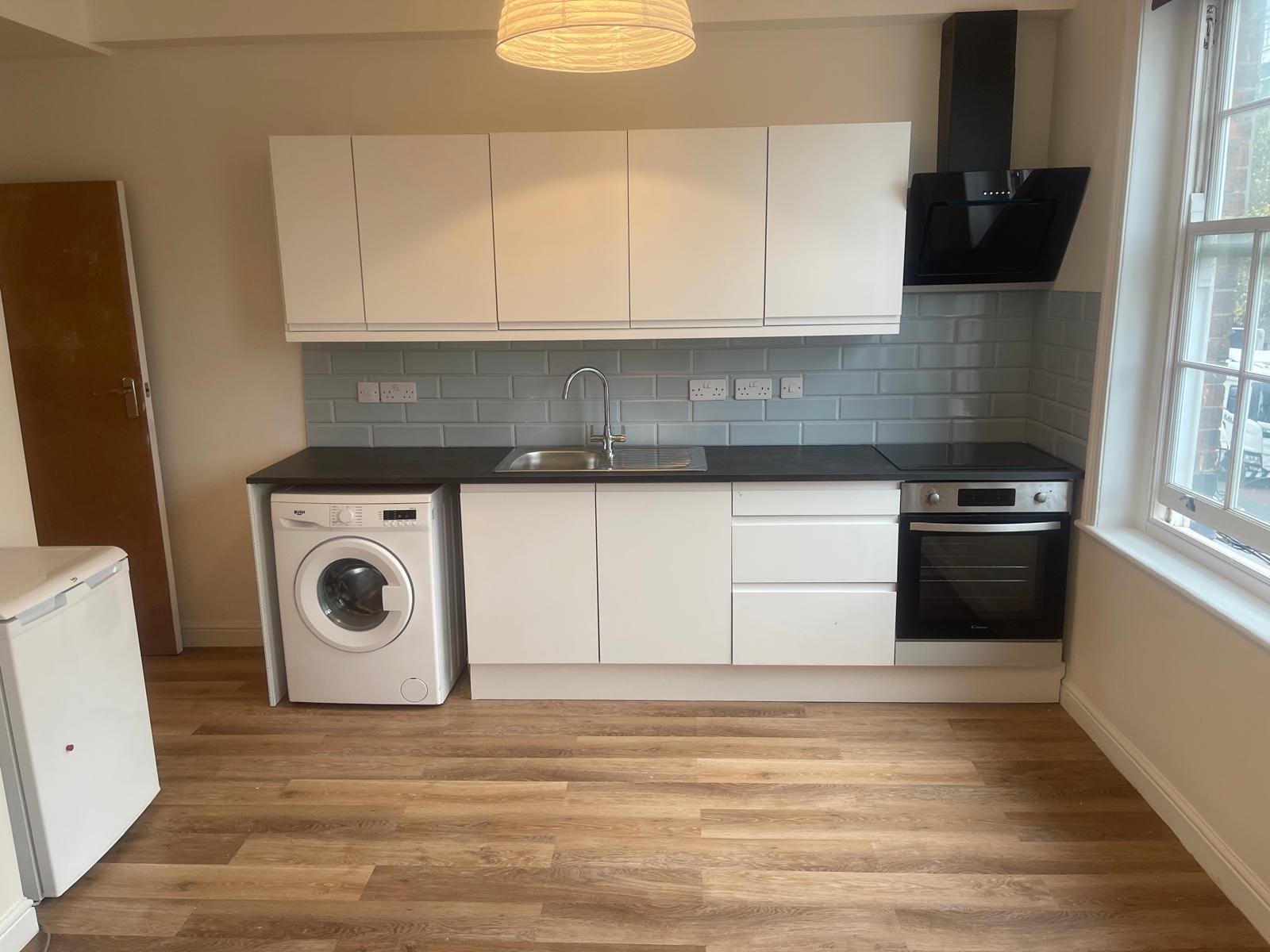 Galley kitchen fit-out with subway tile splashback