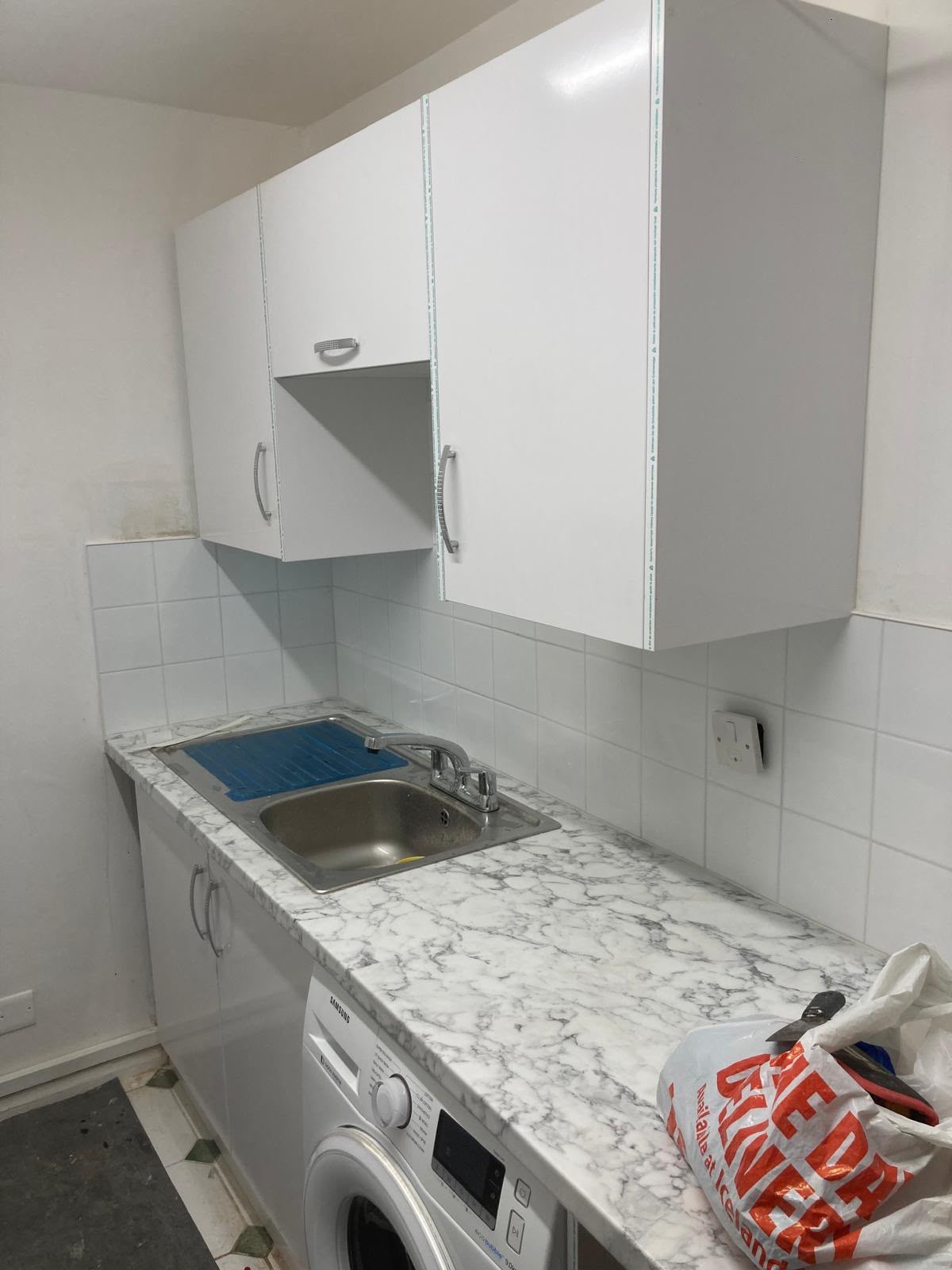 Marble effect splashback fitting