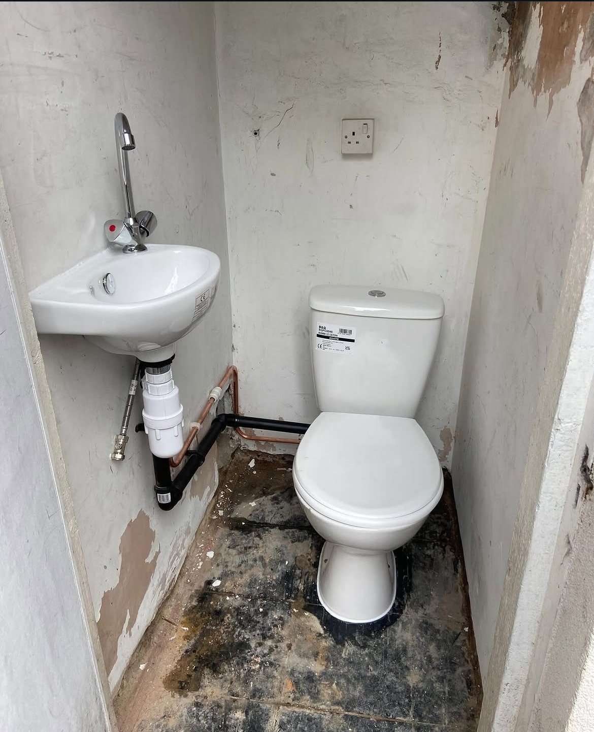 Toilet and pipework installation in progress